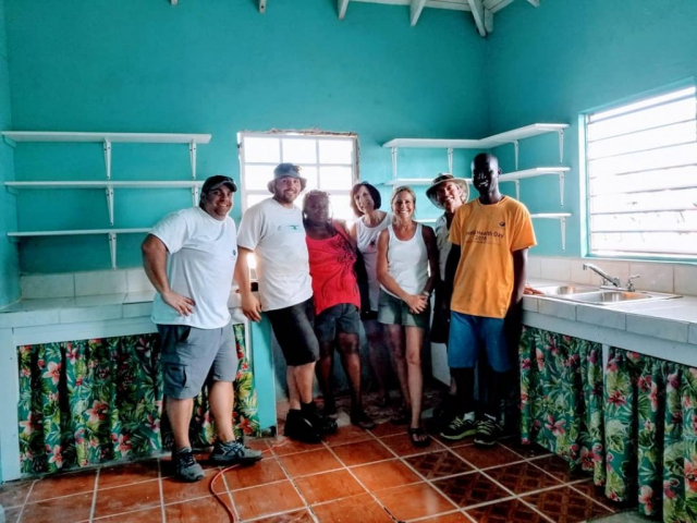 Team-with-Barbudan-woman-after-renovation