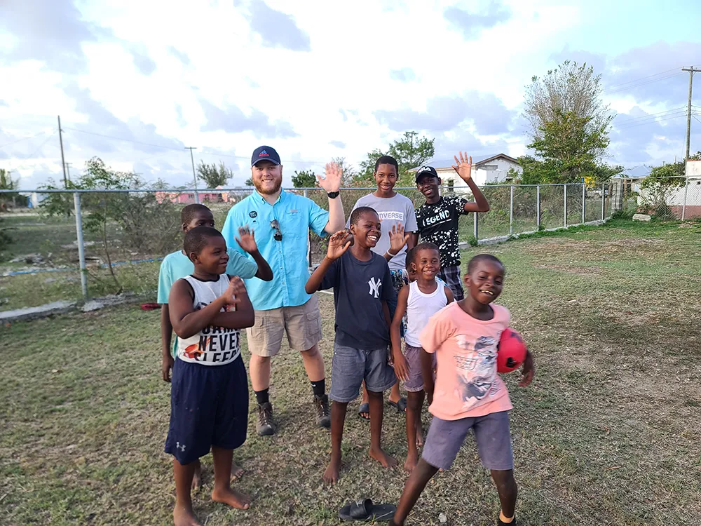 Bonnie Floyd shares a moment of love and trust with a child in Barbuda.